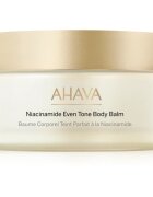 AHAVA Niacinamide Even Tone Body Balm tělový balzám pro rozjasnění a hydrataci 220 ml