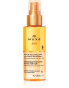 Nuxe Sun Moisturizing Protective Milky Oil For Hair ochranný olej pro vlasy namáhané chlórem sluncem a slanou vodou 100 ml