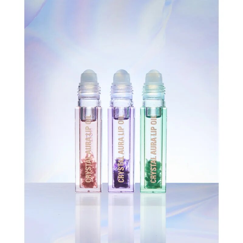Revolution Crystal Aura olej na rty pro výživu a hydrataci odstín Aventurine Cucumber 2.5 ml